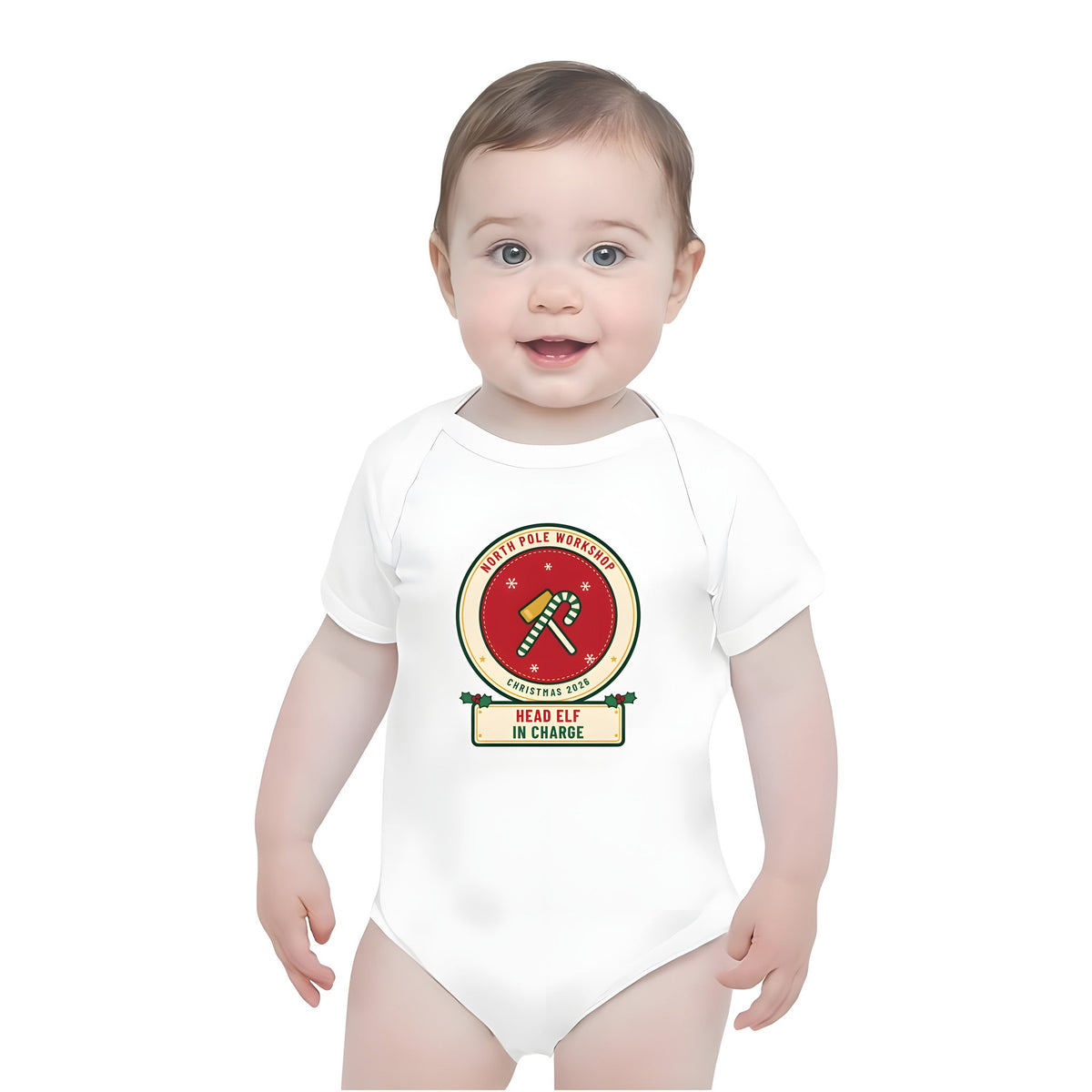 Baby wearing the Build Your Own Badge personalized Christmas bodysuit in White, with HEAD ELF IN CHARGE on the name plate