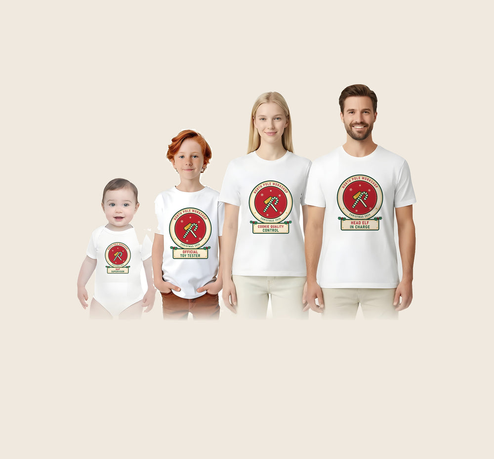 A family in matching North Pole Workshop Christmas shirts: the baby, a kid, Mom and Dad